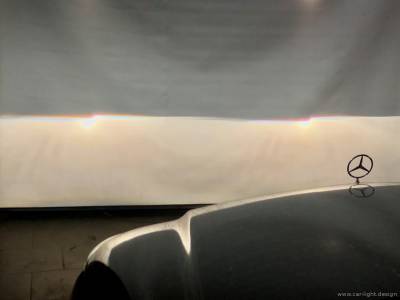 Проекция света биксеноновой линзы в галогеновой фаре Mercedes-Benz