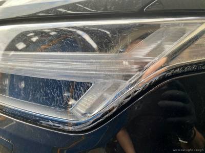 Повреждения на стекле фары Volvo XC 90