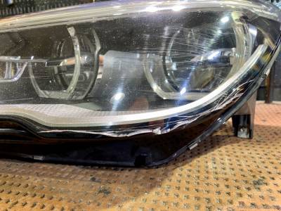 Треснувшее стекло фары BMW 6-Series F12